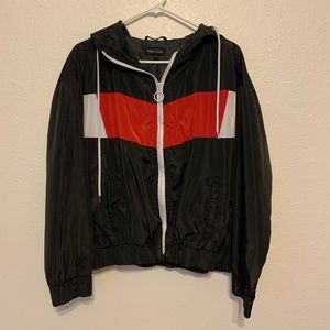 Black, red, and white windbreaker jacker